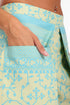 Shorts in printed cotton with front flaps